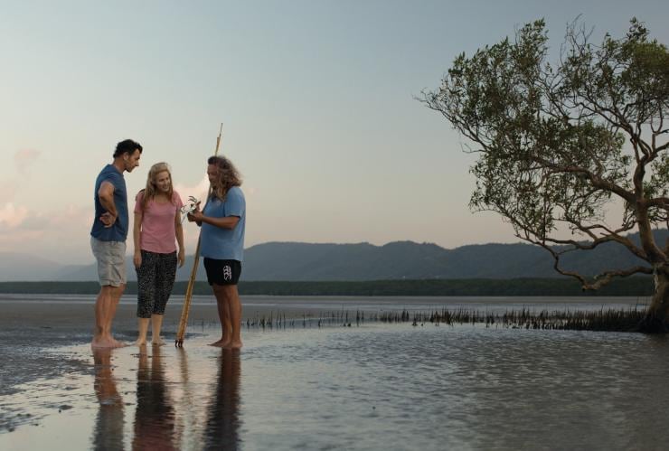 Couple learning how to hunt mud crabs during a Kuku Yalanji Cultural Habitat Tour on Cooya Beach © Tourism and Events Queensland Couple learning how to hunt mud crabs during a Kuku Yalanji Cultural Habitat Tour on Cooya Beach © Tourism and Events Queensland