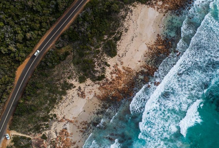 Aerial view of a highway hugging the coastline in Eagle Bay, Dunsborough, Western Australia © Tourism Australia